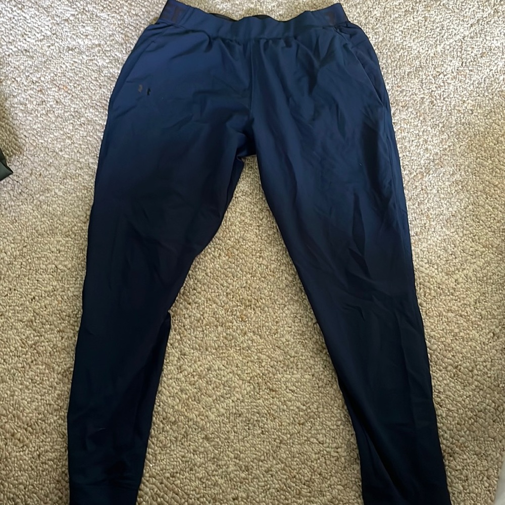 Women’s blue Under Armour pants - very lightweight, higher style, size medium.
